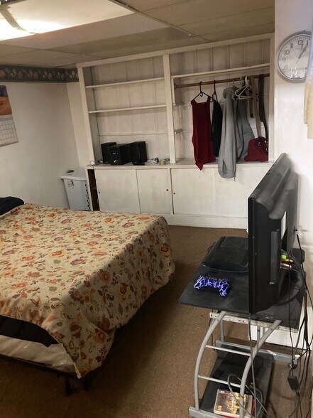 Full size bed w tv and clothing shelves - 764 Lenore Ln