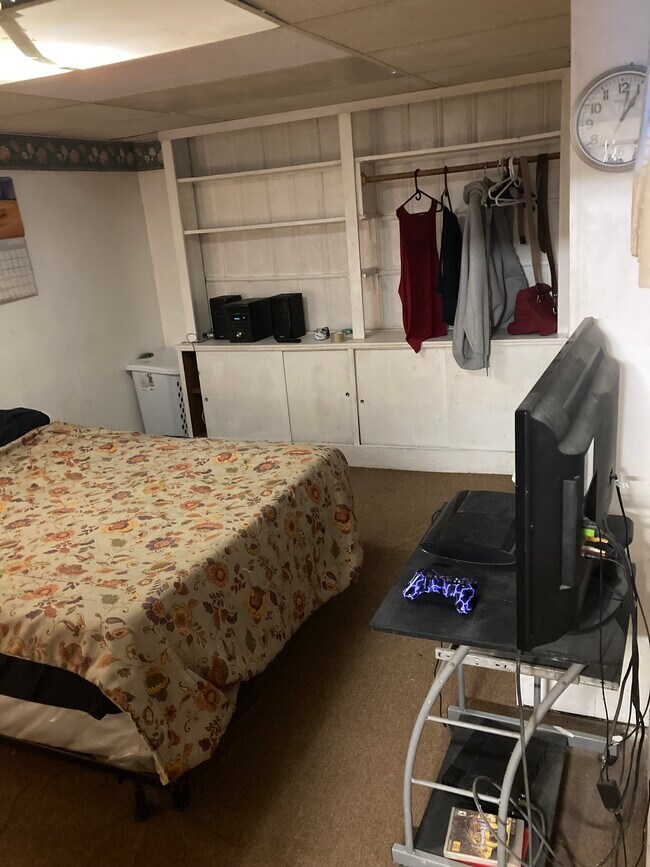 Full size bed w tv and clothing shelves - 764 Lenore Ln