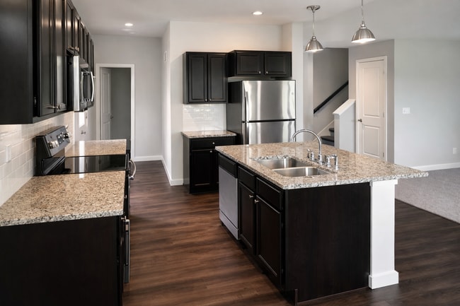 Building Photo - Spacious 3BR / 2.5BA Townhome with Private Rooftop Retreat