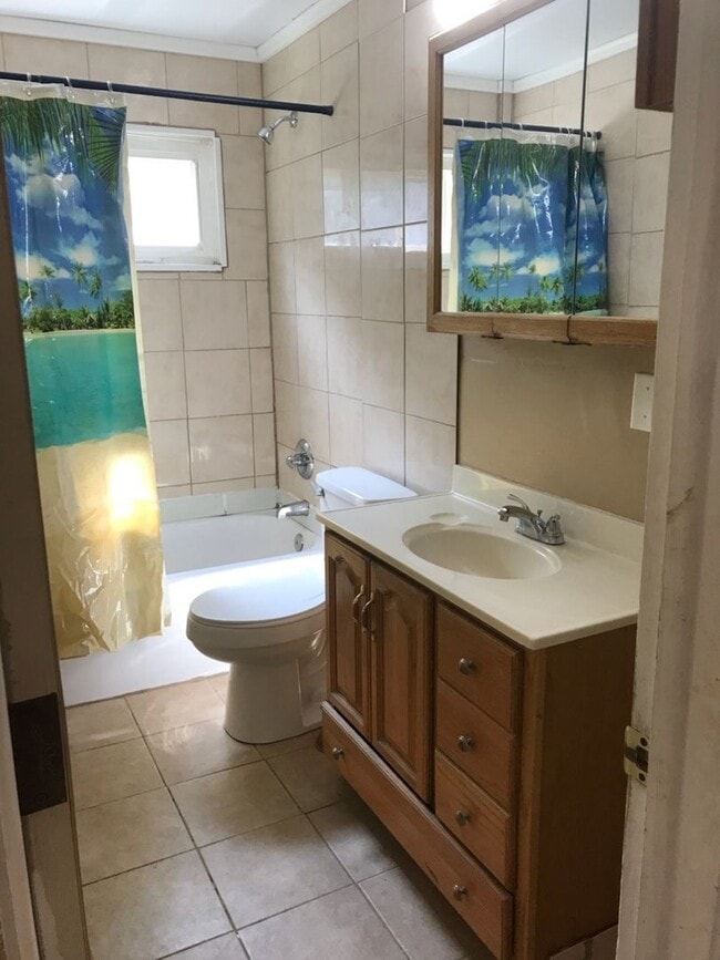 Building Photo - Nice, 4BR rancher with appliances, attached garage and fenced back yard.