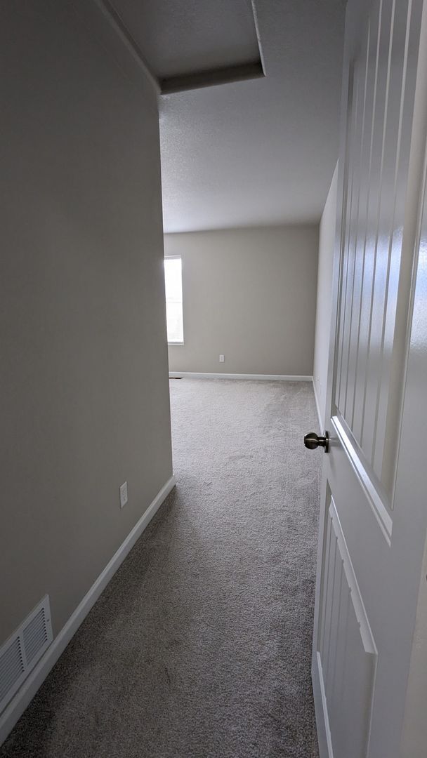 Building Photo - NEWER END UNIT TWO STORY TOWNHOME WITH A/C...