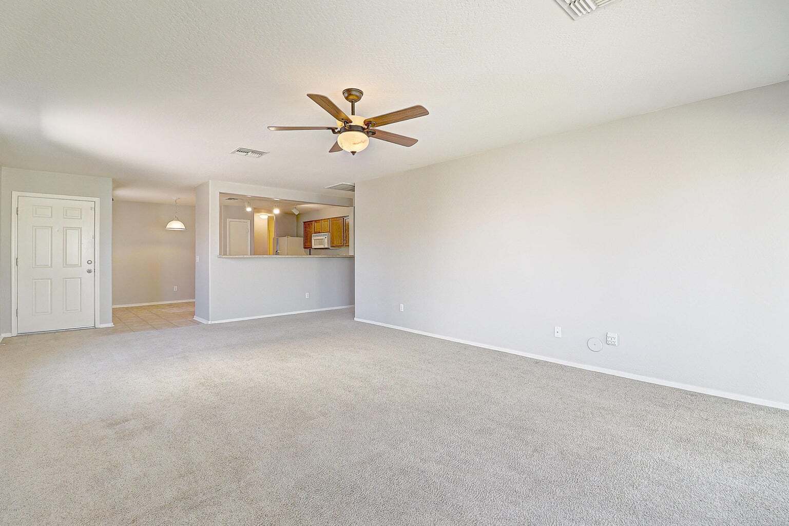 View from livingroom to kitchen - 25586 W North Star Ln