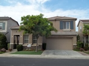 Building Photo - 2-Story home located in the gated communit...