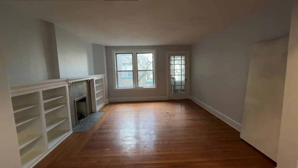 Living room with built ins and rookwood fireplace - 3896 Reading Rd