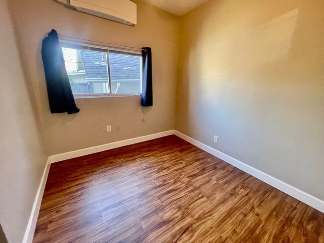 Building Photo - Prime Location! Modern 2BD/1 BA with A/C & EV Charging Steps from Mississippi