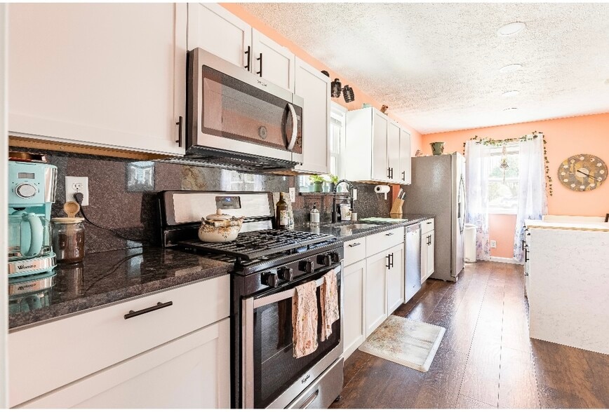 Kitchen has stainless steel appliances, lots of light, and plenty of counter space - 1420 E Market St