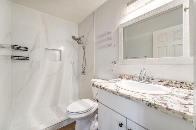 Building Photo - Upgraded Three-Bedroom Condo with Wood Flooring and Modern Comforts!