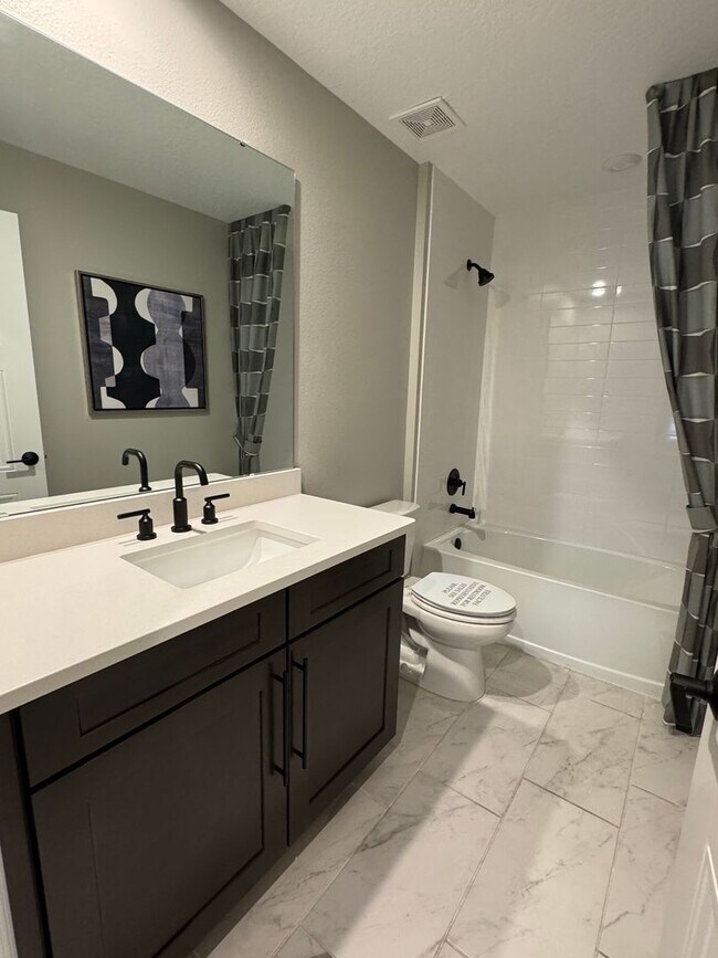 Building Photo - Elegant living in a vibrant, strategically located community—your perfect place to call home.