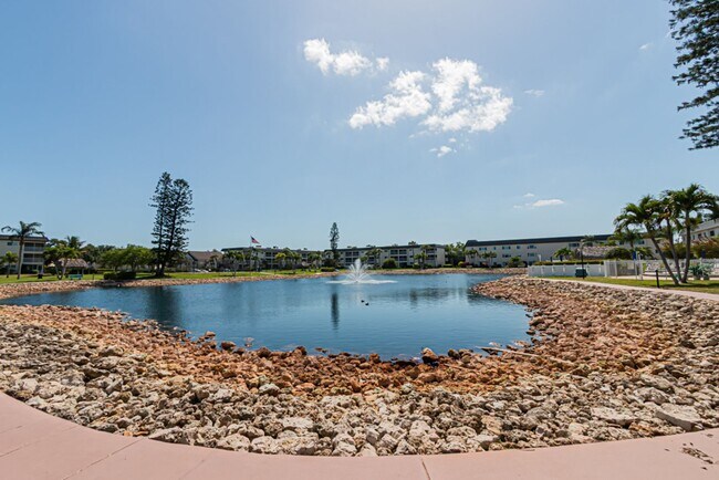 Building Photo - AVAILABLE NOW! Furnished Ground-Floor End Unit | Lake & Pool Views | Minutes to Marco Island & Do...