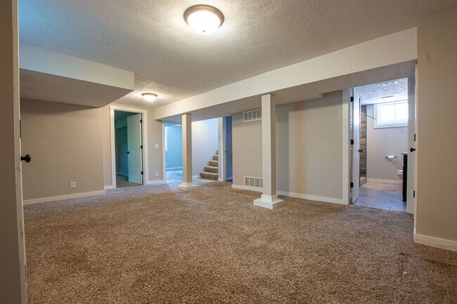 Building Photo - Adorable Brick 4 Bedroom Ranch with Finish...