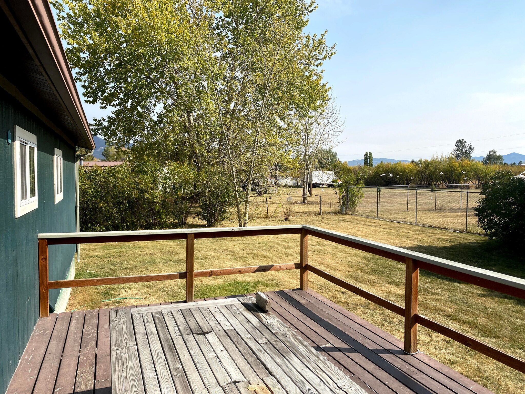View of back fenced yard from back deck - 4270 E Valley Center Rd