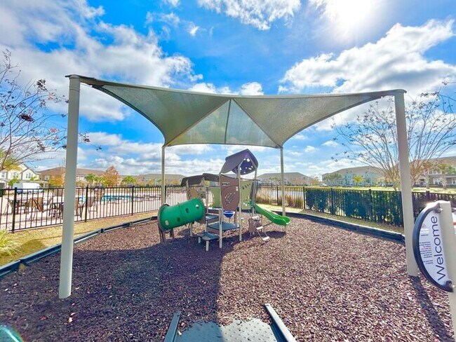 Building Photo - Luxurious 3/2.5 Modern Townhome with a Private Balcony and a 2 Car Garage in the Exclusive Gated ...