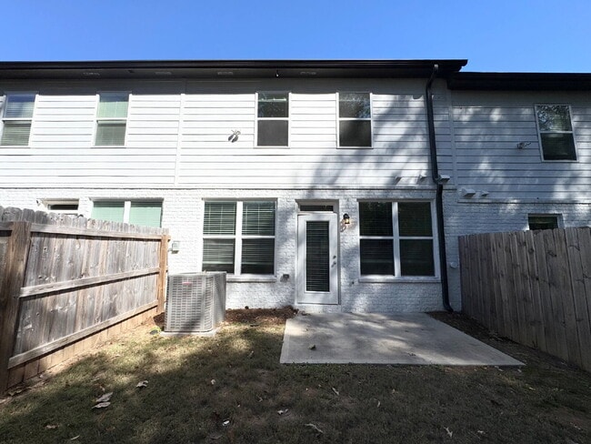 Building Photo - Stylish 3BR Townhome with Private Yard & T...