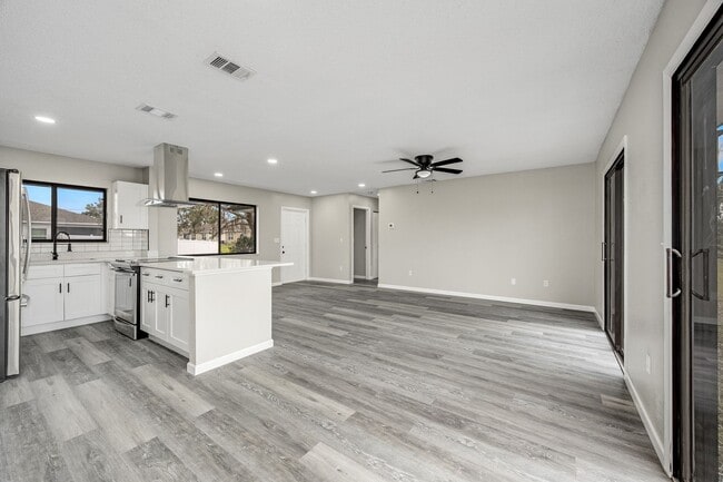 Building Photo - Charming Palm Bay Retreat - Perfect for Relaxation and Entertainment!