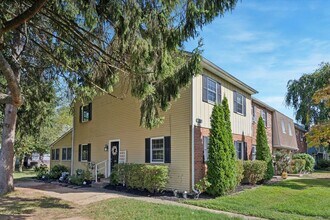 Building Photo - Available Immediately – 4 Bedroom End-Unit...