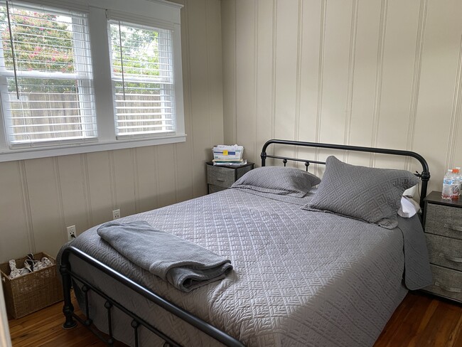 Loads of natural light, refinished hardwoods in bedroom - 604 1/2 Ward Avenue N.E.