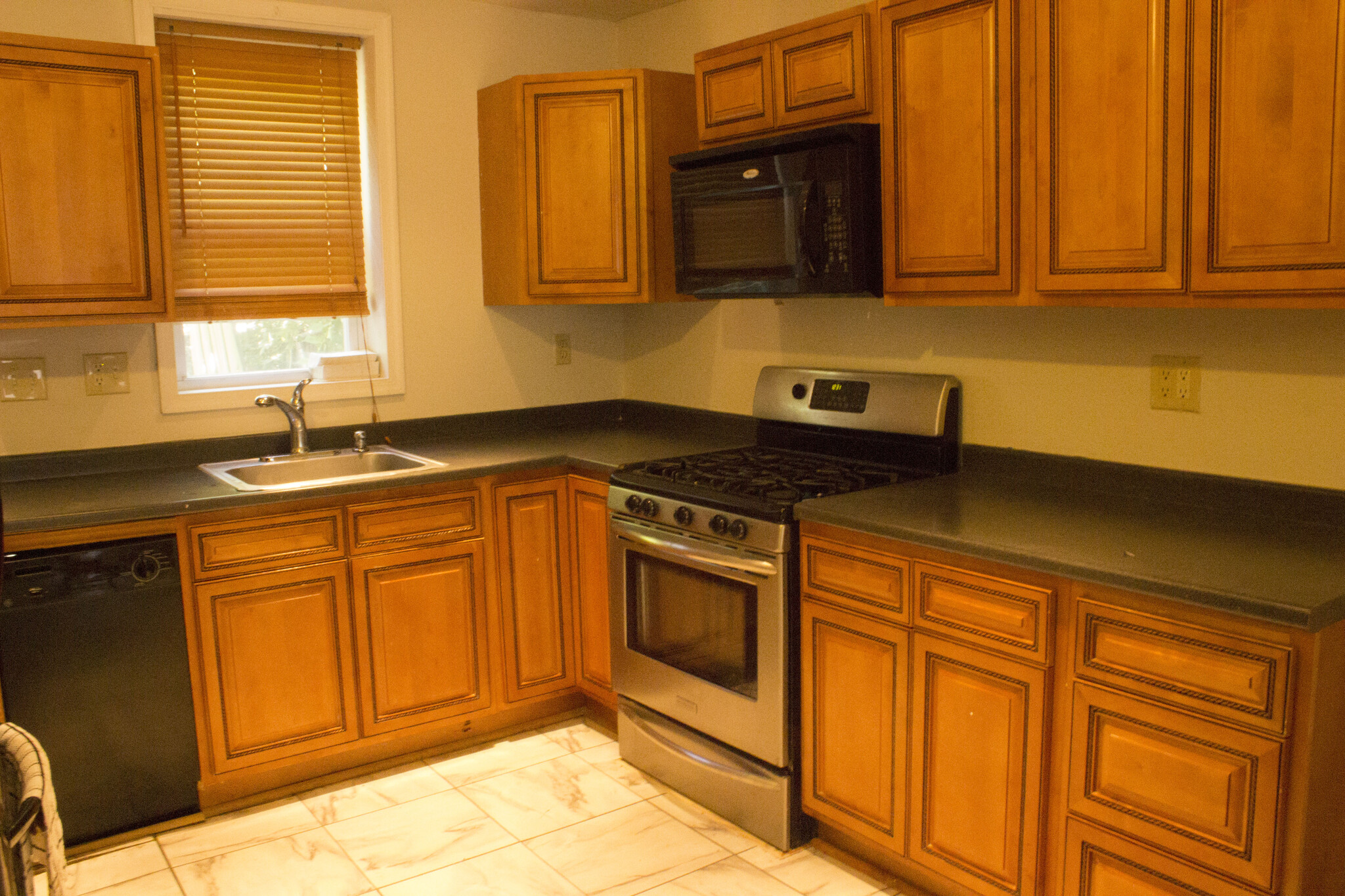 A great kitchen fully furnished with granite counter tops, newer appliances including refrigerator, dishwasher and garbage disposal - 2529 Kimball Street