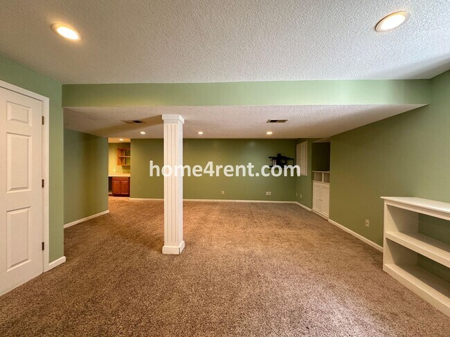 Building Photo - Beautiful Four-Bedroom Home with Three Car Garage, Wood Floors, Finished Basement and a Fenced Ya...