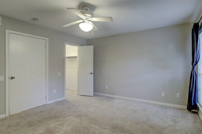 Comfortable bedroom with walk-in closet. - view without furniture. - 1880 White Oak Dr. Apt 119