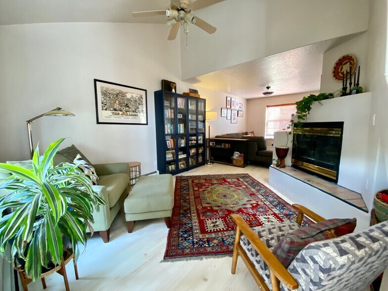 Living room with gas fire place. - 6424 Saint Josephs Ave NW