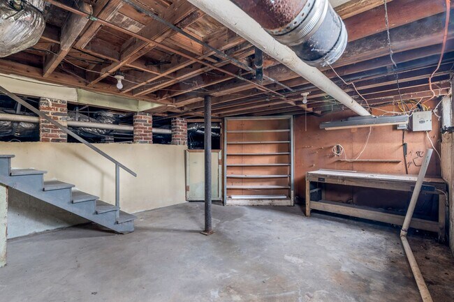 Building Photo - SW, Large Brick Two Bedroom PLUS Two Sun-Rooms, Hardwoods, LR & Separate DR, Fire Place!