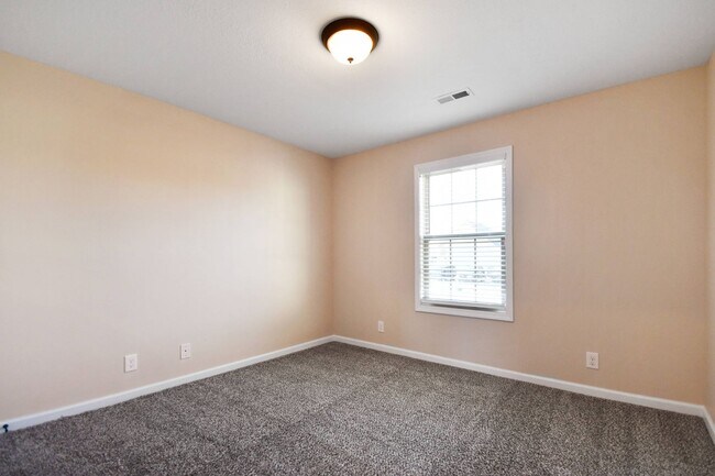 Building Photo - Pet Friendly Three Bedroom with Bonus!