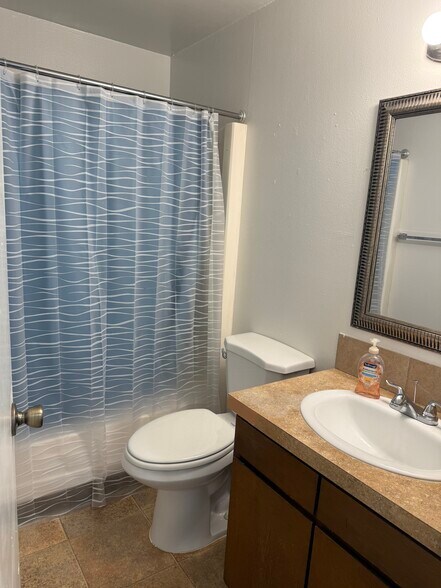 Bathroom with tub and shower - 2403 s kimball ave