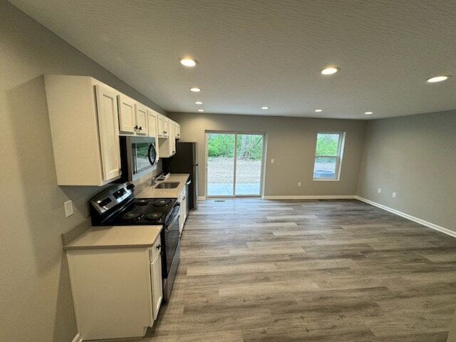Building Photo - Brand-New 2 Bed / 1.5 Bath Townhome with Modern Finishes