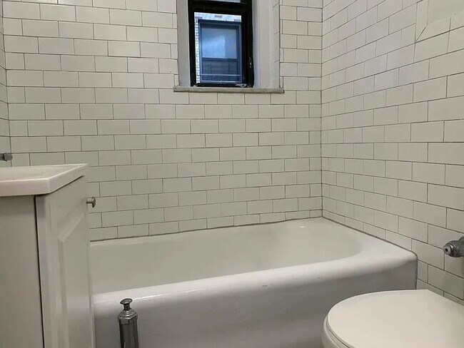 Building Photo - "Chic Urban Retreat: Cozy 1-Bedroom Condo in Vibrant Astoria!"