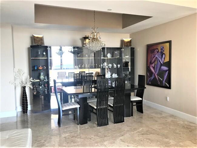 Dining Room with crystal chandeliers - 15901 Collins Ave