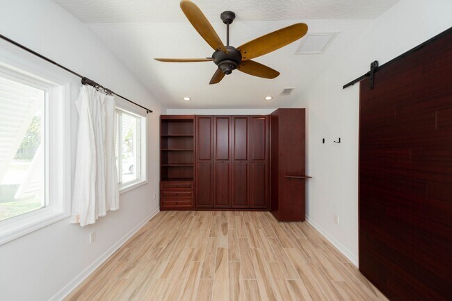 Building Photo - Live the ultimate Space Coast waterfront lifestyle at this stunning beachside canal home in Satel...