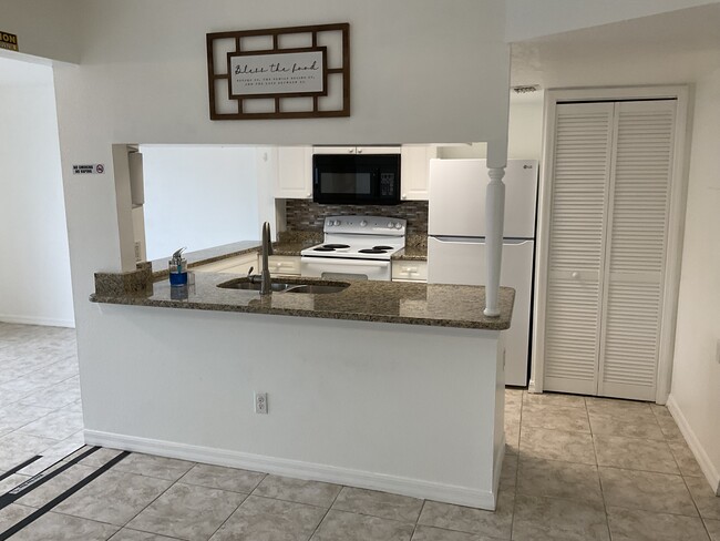 Kitchen with 2 Eat-in Counters - 329 Orchid Dr