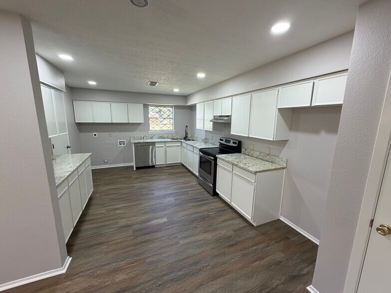 Open kitchen from dining area w/plenty of storage - 415 N 33rd St