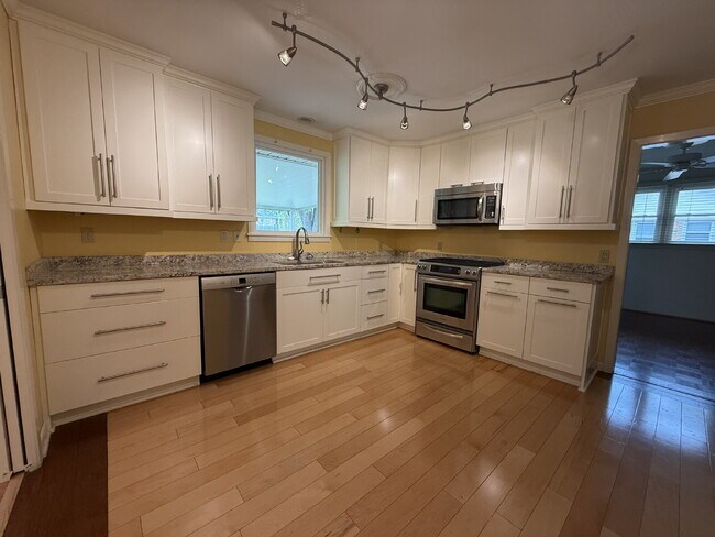 Building Photo - Modern Comforts with Granite & Hardwood Finishes!" 3 Bedroom 2 bath home.