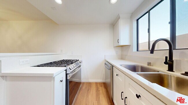 Building Photo - 10220 De Soto Ave