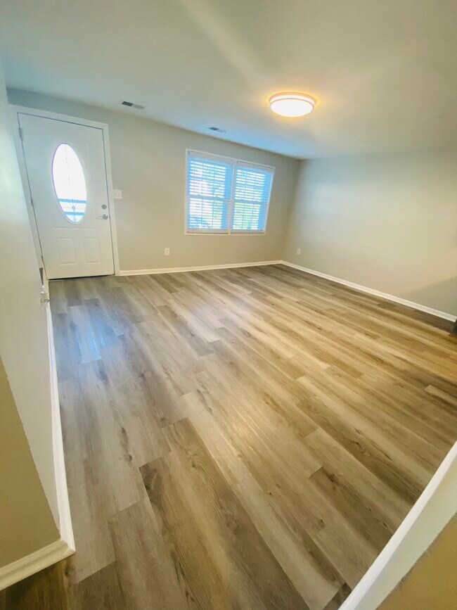 Open floor plan- living and dining area - 1861 Village Green Dr