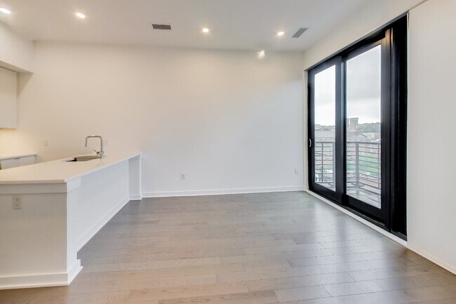 Building Photo - Top floor residence in elevator building with sweeping views.