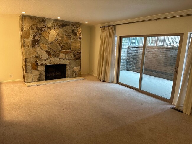 Building Photo - Spacious Millcreek Townhome with Two Living Areas, Private Deck & Community Amenities