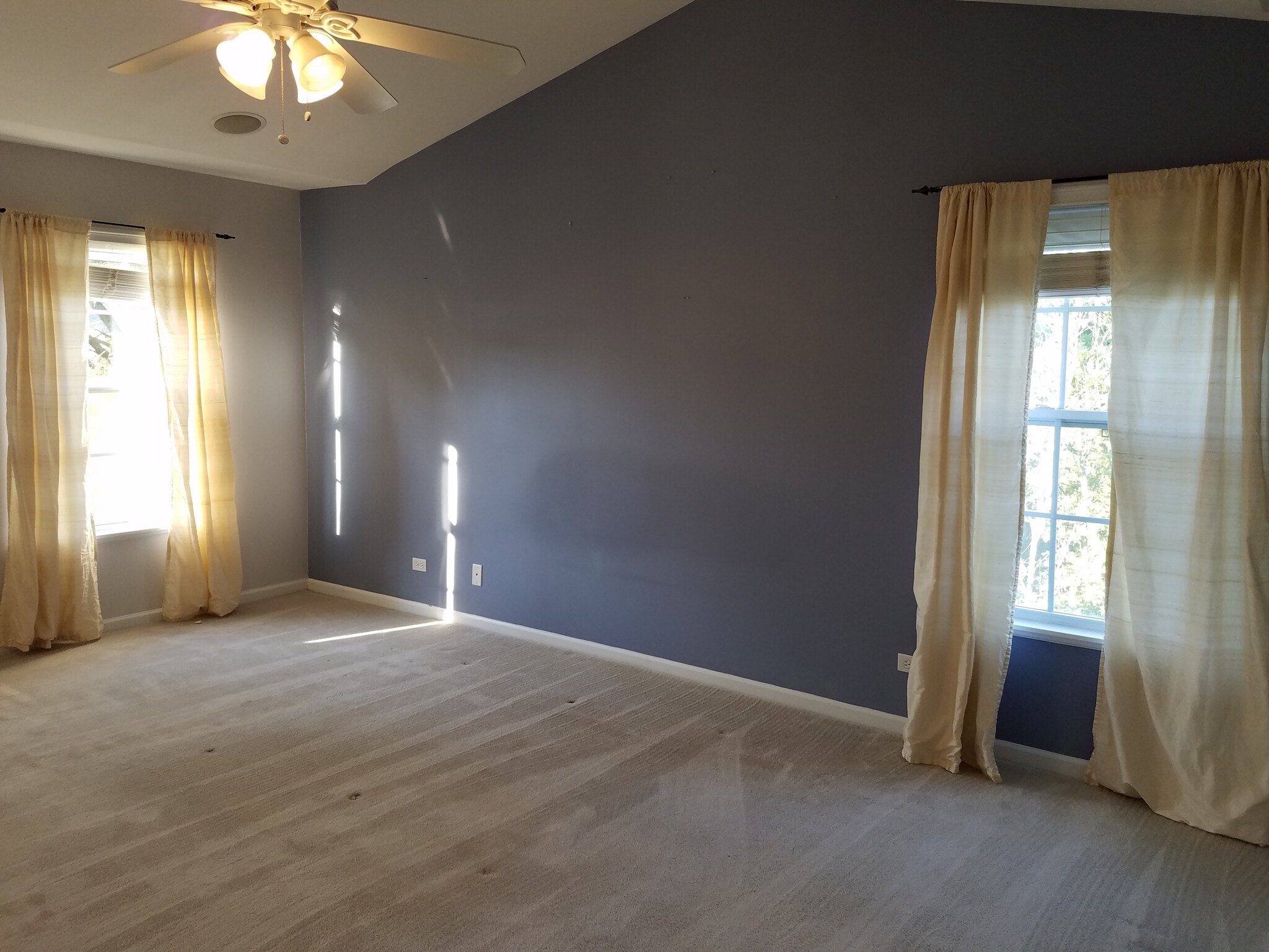 Master bedroom with vaulted ceiling, fan, corner with lots of windows - 135 Patrick Ave