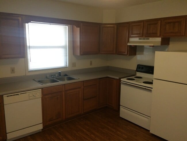 Building Photo - Brick Home with Carport & Fenced yard