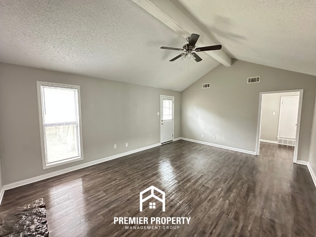 Building Photo - Quiet 3BR/2BA Cove Near Southwind | Soaring Ceilings & Floor-to-Ceiling Stone Fireplace