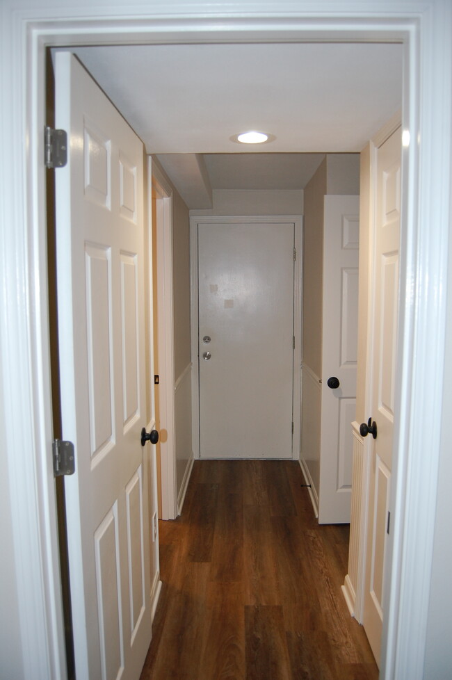 Hallway to 3rd bathroom and 4th bedroom - 3075 Chartwell Ct