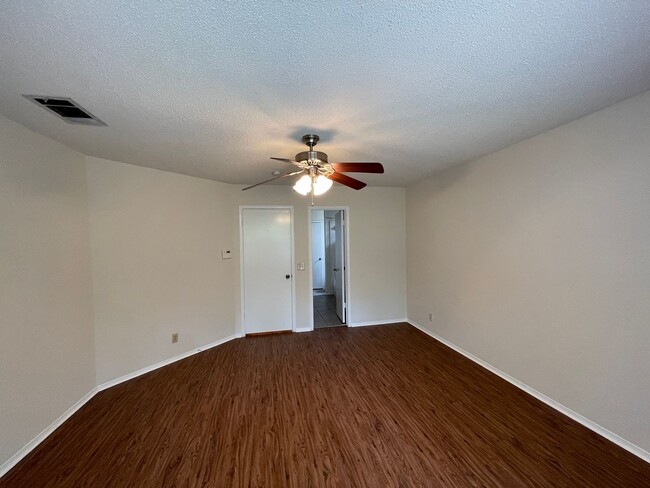 Building Photo - SPACIOUS HOME - NEW FLOORING! - 2 LIVING A...