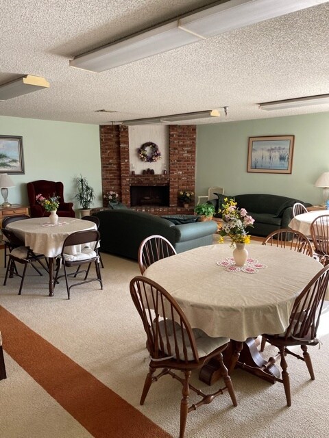 Community area downstairs with fireplace - 18900 Delaware St