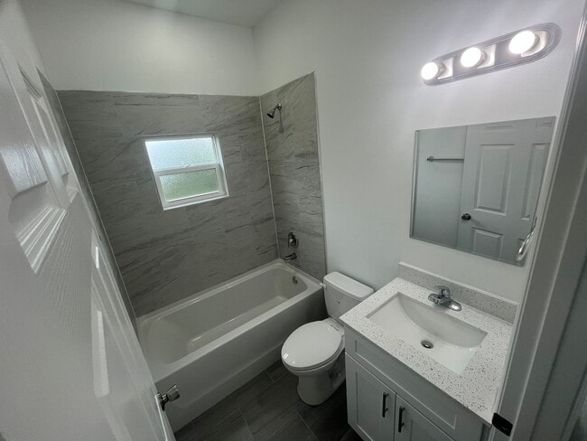 Building Photo - New 4 Bed / 2 Bath / 2 Car Garage Family Retreat in Desirable Lehigh Acres!