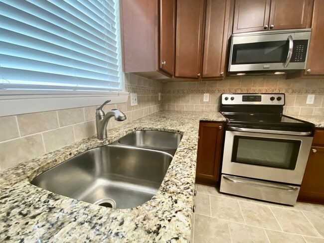 Building Photo - Ready 07-10-26! Great 3-bedroom home in Aragona Village! Stainless Steel Appliances, Granite Coun...