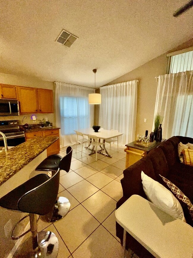 Building Photo - Modern 4-Bed, 2-Bath Solar-Powered Home Near UCF