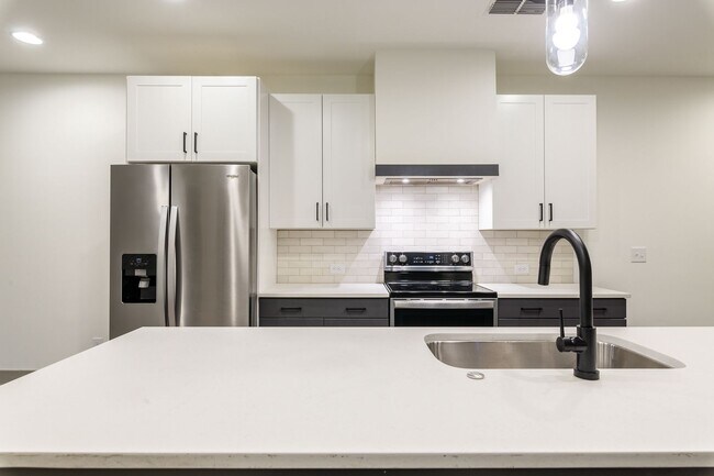 Building Photo - Modern Living Meets Walkable City Charm in...