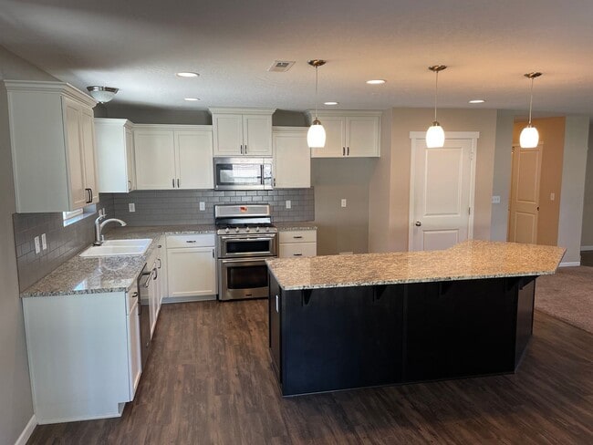 Building Photo - Mead Schools-4 bedrooms, 2 bathrooms House with 2 Car Detached Garage