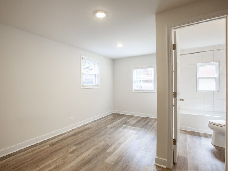Light filled bedroom with laminate flooring - 612 Rock Creek Road